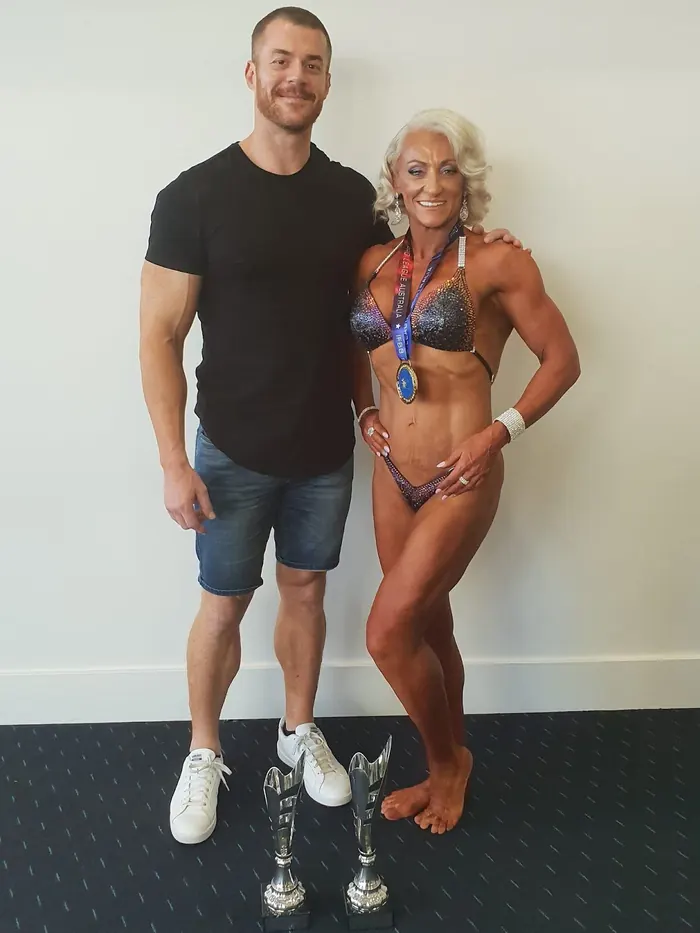 Michael Lea with a bodybuilding competitor he coached
